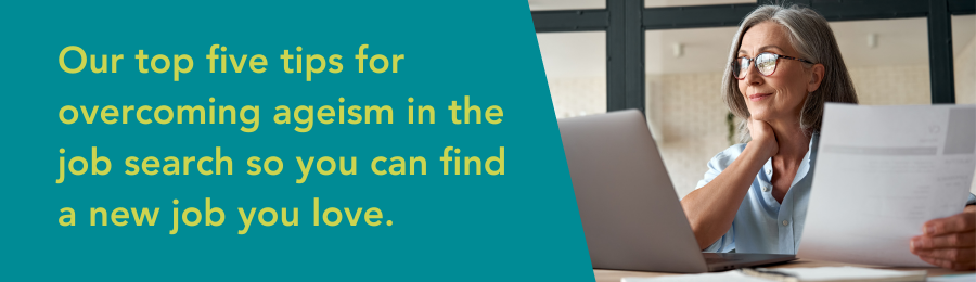 Text: Our top 5 tips for overcoming ageism in the job search so you can find a job you love. Image of woman with white hair sitting at her laptop.