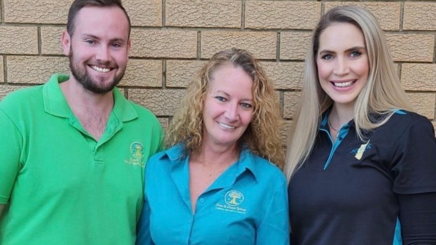 Luke and Justine from Done n Dusted stand with Desiree from atWork Australia